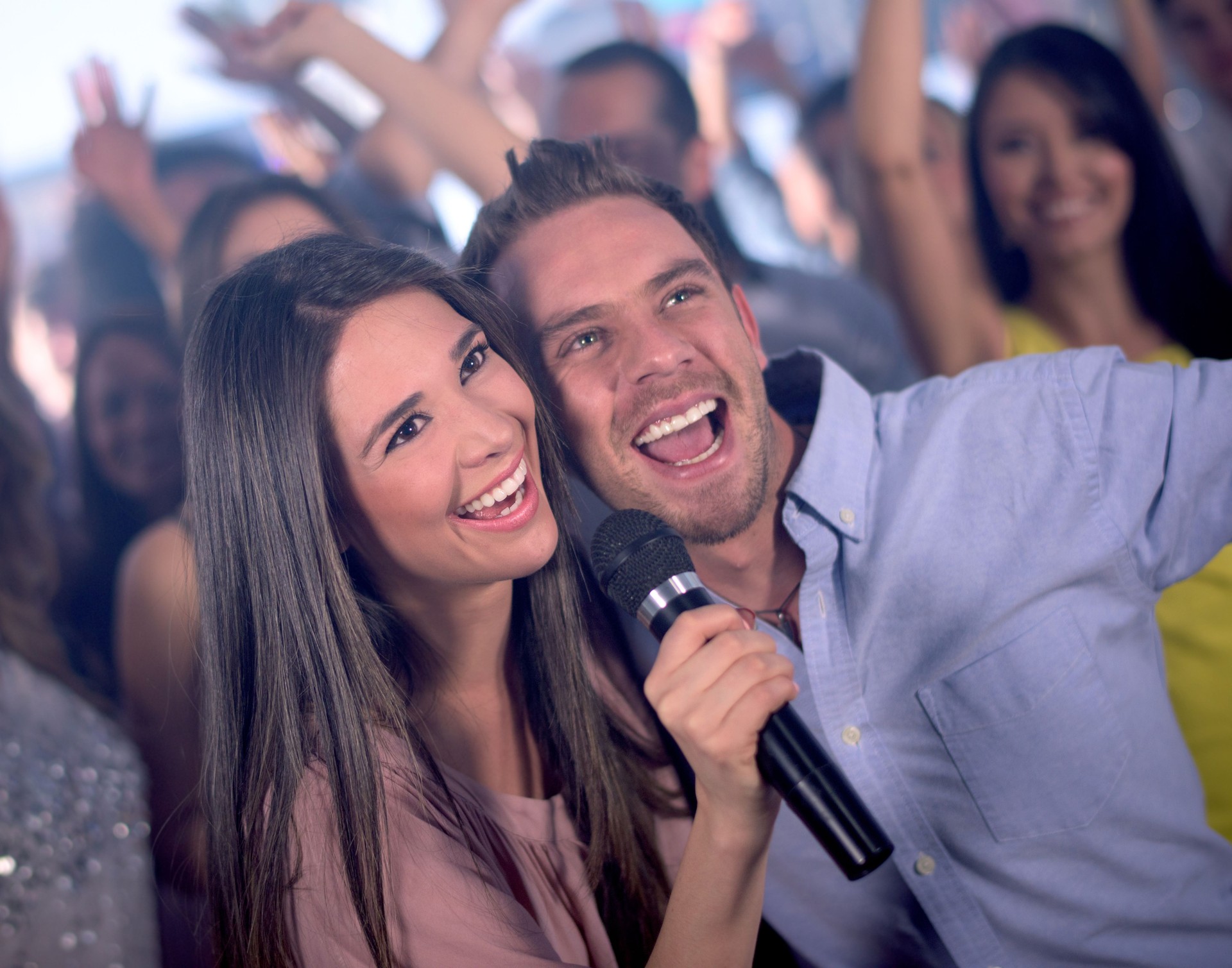 Couple partying at a karaoke bar